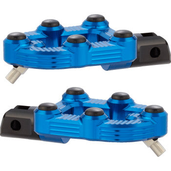 A pair of blue MX Footpegs - Driver by Arlen Ness is shown, featuring black and silver accents, a textured surface with raised grip points, and durable billet aluminum construction for enhanced traction and performance.