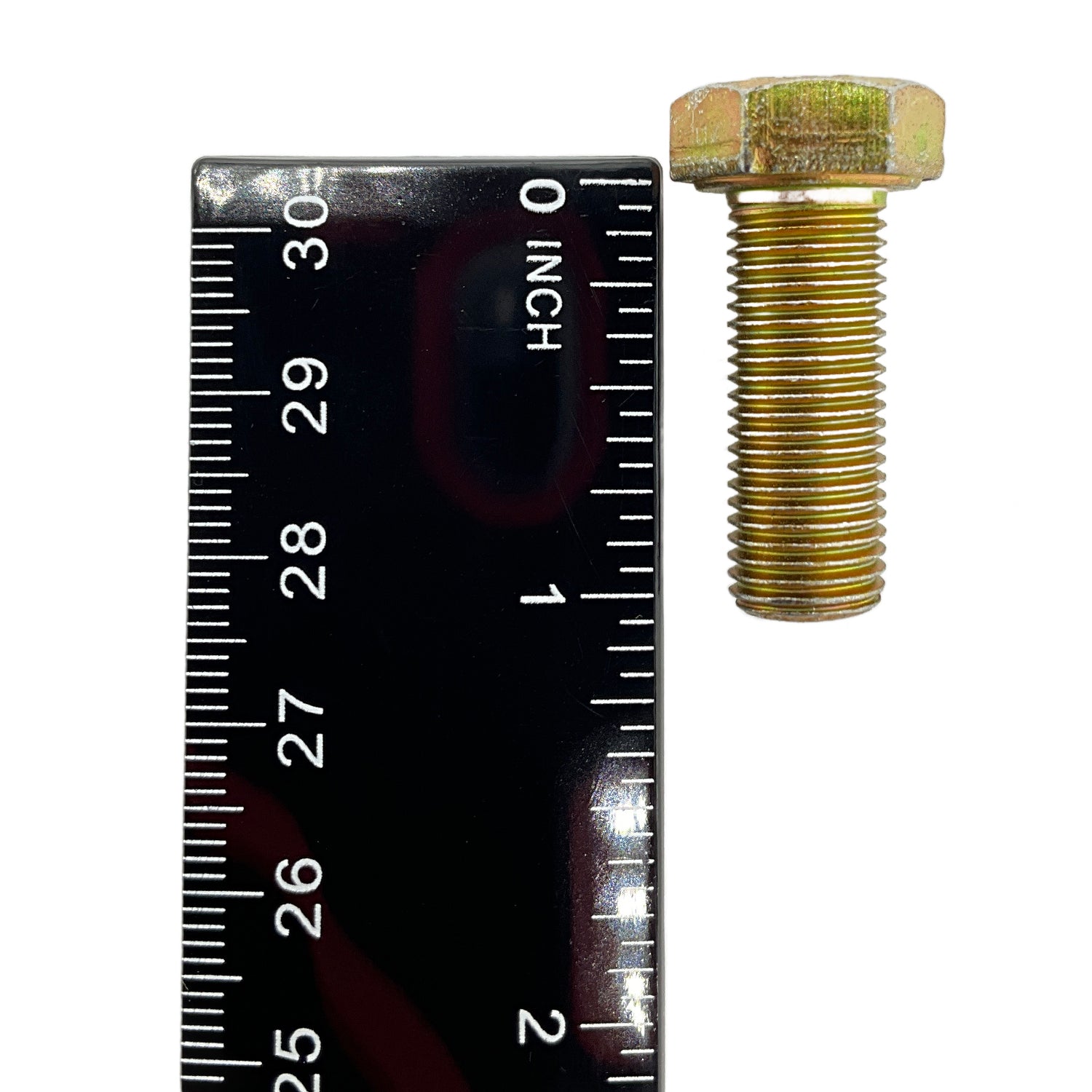 Gold-colored hex bolt with fully threaded shaft next to a black ruler showing about 1 inch length.