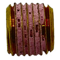 Brass hex socket plug with pink thread sealant on external threads.