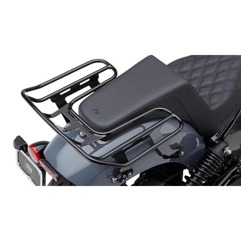 A close-up of a motorcycle’s rear section highlights an Indian Rogue seat with diamond pattern and a Detachable Big-Ass Luggage Rack, 2-Up Black for Indian Chief 22-24 by Cobra installed above the rear fender.