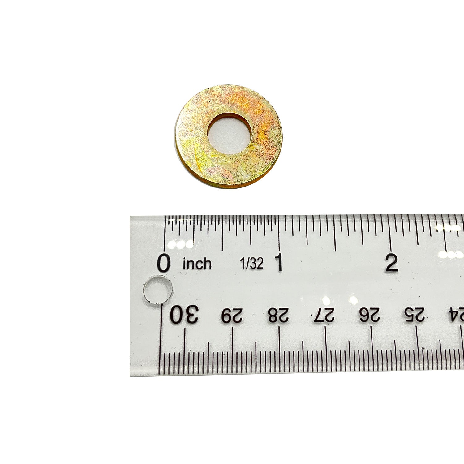 Small round metal flat washer with a central hole, shown next to a ruler for size reference.