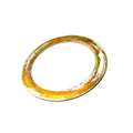 Gold-toned metal flat washer with smooth surface and circular shape.