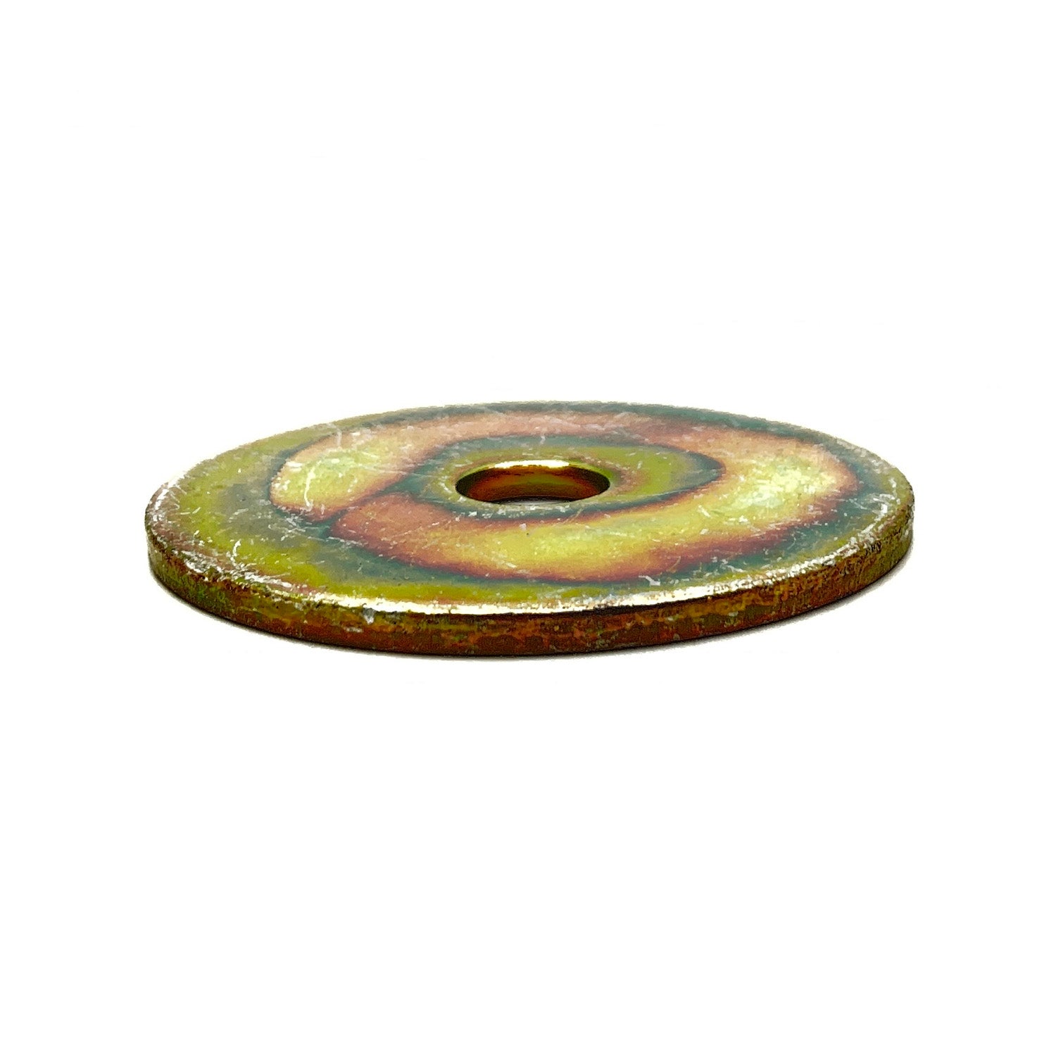 Round metal washer with a central hole, rusted and weathered surface showing brown and yellow patina.