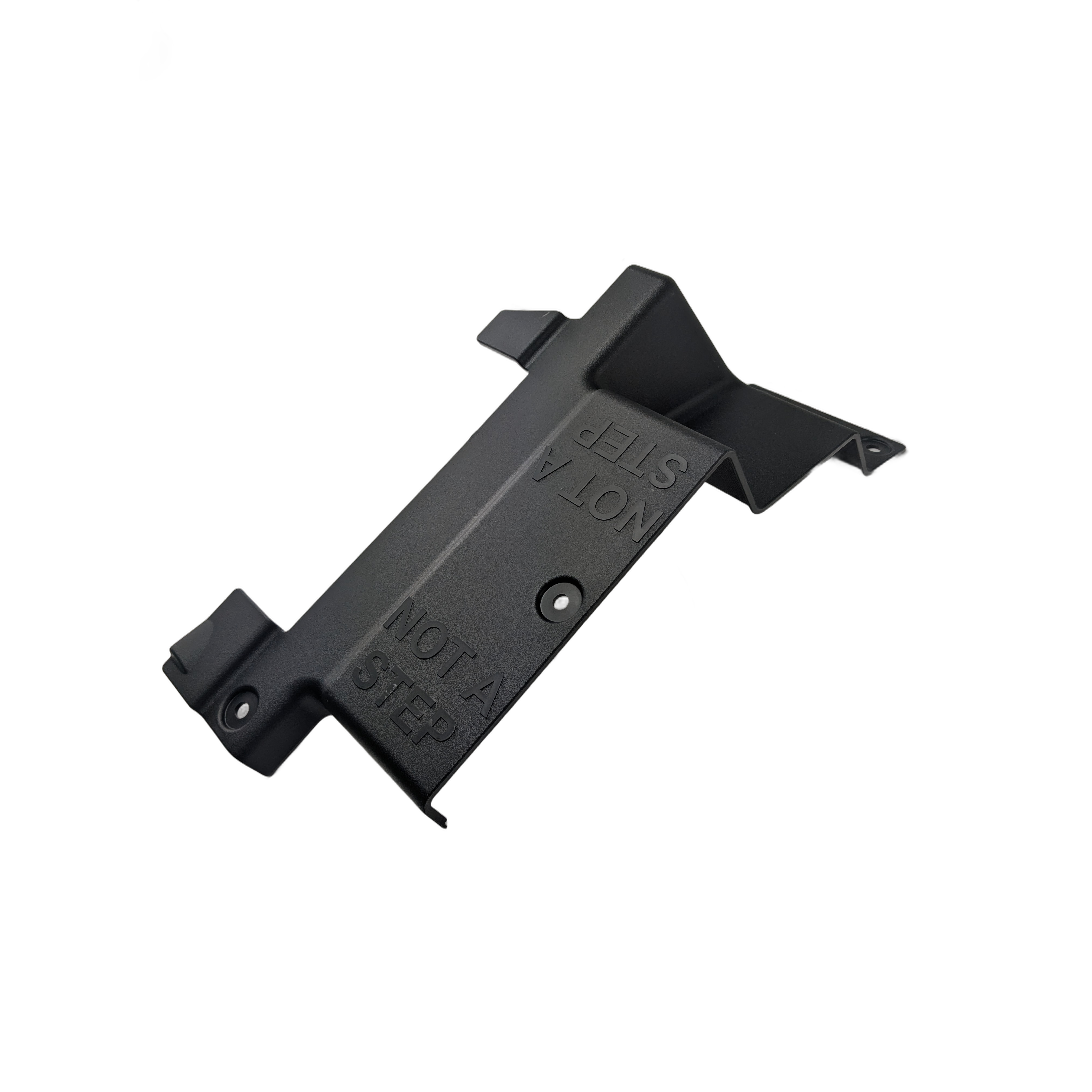 Black plastic rear foot well lid with angled edges and embossed "NOT STEP" warnings.