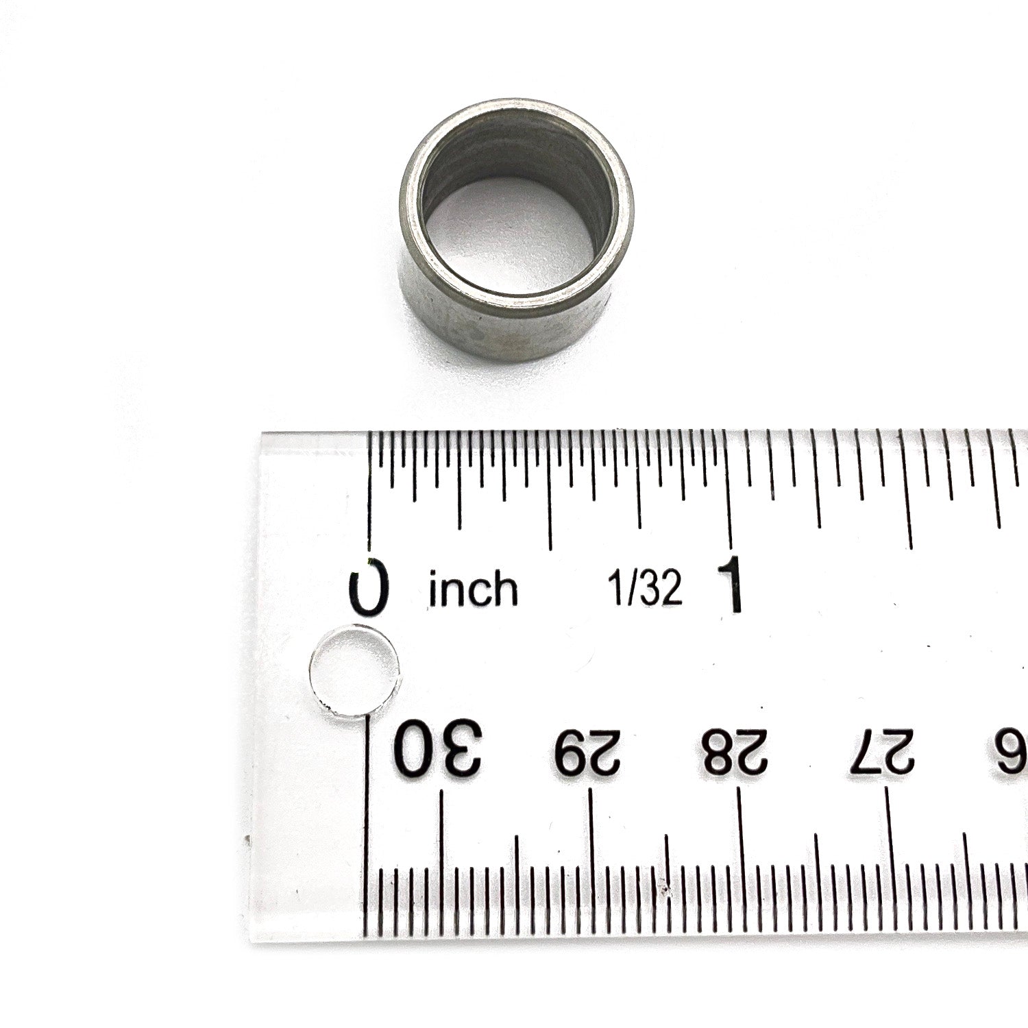 Metal hollow dowel sleeve, cylindrical shape, silver finish, about 1.2 cm diameter next to clear ruler.
