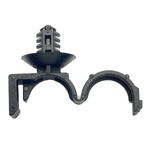 The Hinged Routing Clip by Polaris is a black plastic fastener with dual clamp openings, ideal for securing pipes or cables in vehicles. Compatible with OEM Victory Polaris parts—perfect for maintaining Victory motorcycles.