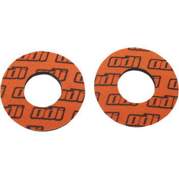 Two round orange foam grips with black repeating "odi" logos printed across the surface.