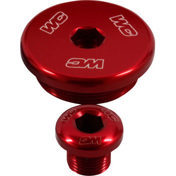 Two red Kawasaki - Suzuki Engine Timing Plugs by Works Connection, each with "WC" engraved on top, are shown on a white background. The metallic plugs have an anodized finish and feature threaded sides for secure fit.