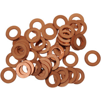 A pile of Bolt Drain Plug Washers M8, small round flat copper washers with center holes, scattered on a white background. Ideal as OEM replacement parts for various applications.