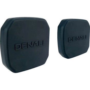 Two black, square-shaped Light Cover - Blackout - D4 by Denali rubber pads with rounded corners and DENALI embossed on the front, shown from front and angled views against a white background.