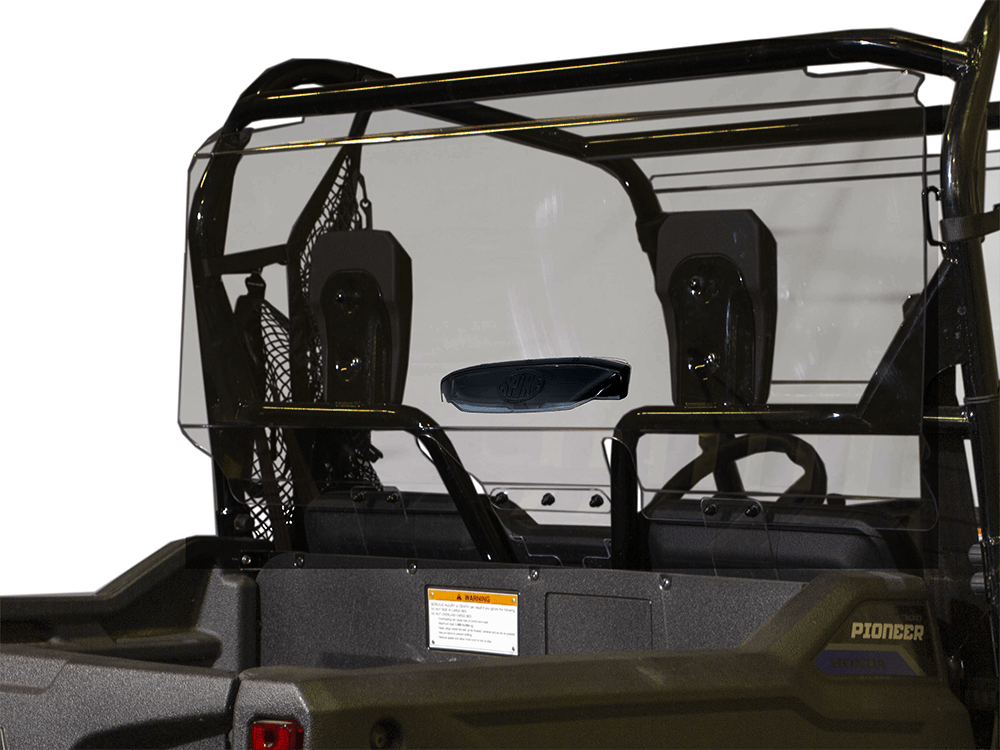 Rear view of a black off-road utility vehicle with a Honda Pioneer 700 Tinted Vented Rear Windshield by Spike, two seats with headrests, mesh barrier behind seats, and visible Pioneer logo. Find more at Witchdoctors.com.