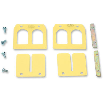 Yellow rectangular Yamaha replacement reed valves with curved cutouts, metal mounting plates, and silver screws set on white