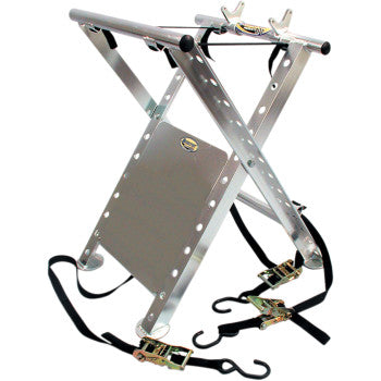 The Pro ATV X-Stand Silver by Motorsport Products is a foldable, silver metal stand with cross-braced legs, angled side supports, and black straps with frame hooks and ratchet tie-downs at the bottom.