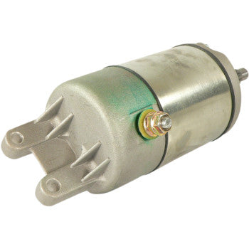 The Starter Motor by Parts Unlimited is a metallic cylindrical unit with mounting brackets and electrical terminals, built to OEM specs with durable copper bushings, commonly used in engines, shown on a white background.