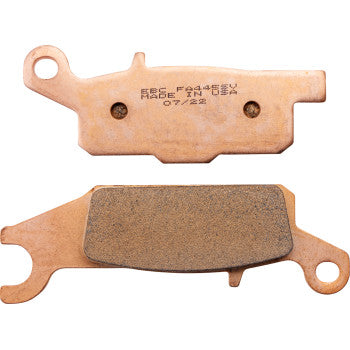 Two SV Severe Duty Brake Pads by Ebc are shown: one with engraved text, the other exposing the friction material. Both feature uniquely shaped ends for versatile utility use and are engineered for ultra-long pad life.
