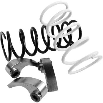 Black and white coil springs with two curved metal clutch components for offroad vehicle use.