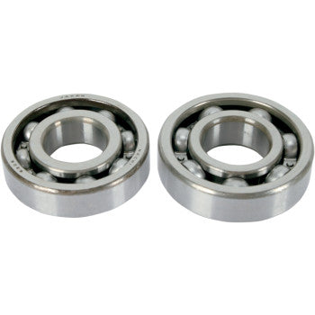 Pair of silver metal ball crankshaft bearings with inner and outer circular races and visible steel balls.