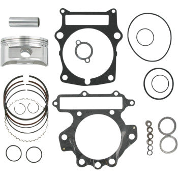 Silver metal piston with grooves, black rubber and metal gaskets, and assorted circular seals arranged on white background.