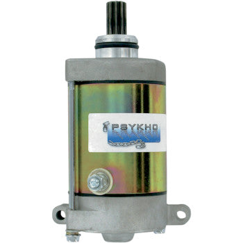 The Yamaha Starter Motor by Psykho features a cylindrical metallic design with a shiny finish, two mounting brackets at the base, and a black gear shaft on top. A Psykho brand label is attached—ideal as an OEM replacement.