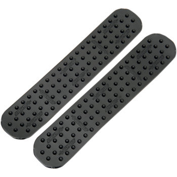 Two black rectangular Traction Pad All Purpose Mini Strips by Stompgrip, featuring rows of raised dots and rounded corners, offer reliable under-foot traction—an ideal diamond plate replacement for various surfaces.