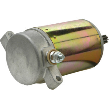The Starter Motor by Parts Unlimited is a cylindrical metal electric motor with a gold-tinted casing, two mounting brackets, side bolt, copper bushings, and a gear—ideal for OEM starters.