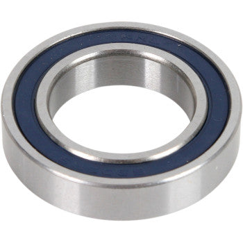 A close-up of the Parts Unlimited Wheel Bearing Double Seal 25x42x9, featuring its circular shape, smooth polished surface, and blue double rubber seals.