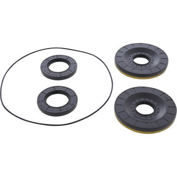 Four black circular mechanical parts and one thin rubber ring, likely TC seals or gaskets of various sizes, are arranged on a white background. They are components from the Can Am Differential Seal Kit Rear by Moose Offroad.