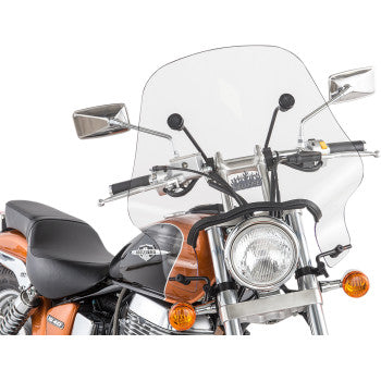 A close-up of a motorcycle with the Hellfire Windshield - 17 - Clear by Slipstreamer, showcasing clear acrylic, an orange and black body, round headlight, rearview mirrors, and visible turn signals.