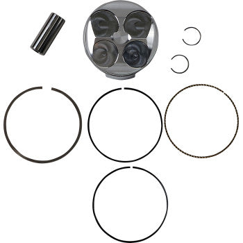 Silver piston with four valve reliefs, black wrist pin, two circlips, and four black piston rings arranged neatly on white.