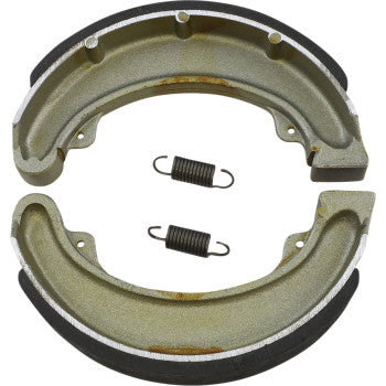Two Honda Brake Shoes by Dp Brakes, each with black edges, are arranged in a circle with two coiled springs between them, highlighting high-tech performance on a white background.