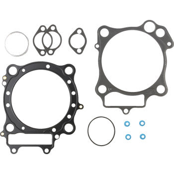 The Honda Top End Gasket Kit 101 mm by Cometic includes assorted engine gaskets and O-rings made with Extreme Sealing Technology, featuring large circular and square seals plus smaller rings, all displayed on a white background.