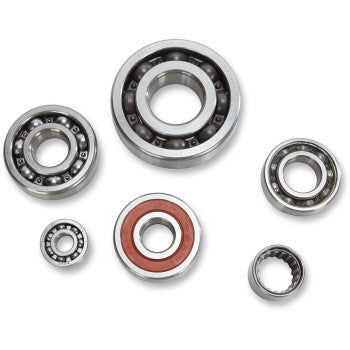 Set of six metal transmission bearings in various sizes, one with a red seal, arranged on a white background.