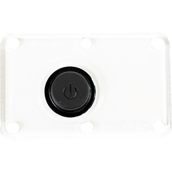 The Lens Dome Light Clear by Heretic is a rectangular white plate with four corner holes and a central black button featuring a power symbol, designed as a replacement lens for the Heretic Dome Light.
