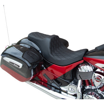 Black leather motorcycle seat with double diamond stitching, contoured for forward positioning.