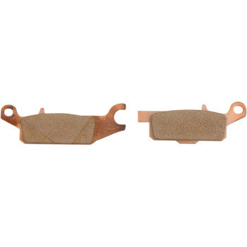Two SV Severe Duty Brake Pads by EBC with copper-colored backing plates, distinct shapes, and tabs/hooks are shown side by side on a white background—ideal for mud and sand.