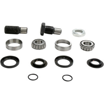 Metallic and black rubber swingarm bearing kit components including bolts, rings, and tapered roller bearings arranged on a.