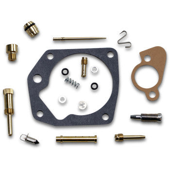 Polaris Carburetor Repair Kit by Shindy includes small parts like main jet, gaskets, screws, jets, needles, springs, and seals from a carburetor rebuild kit, arranged on a white background.