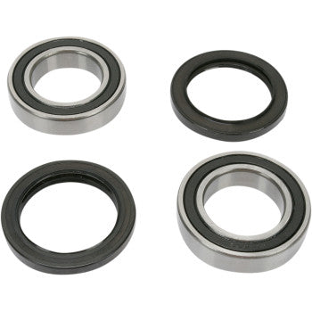 The Kawasaki-Suzuki-Arctic Cat Wheel Bearing Kit Rear by Pivot Works features four circular bearings with black rubber seals, arranged to show both metal and rubber-sealed sides on a white background for enhanced steering control.