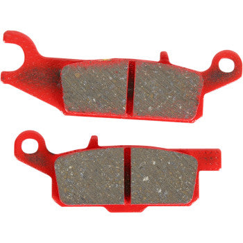 Red metal sport carbon brake pads with textured friction surfaces and mounting holes, designed for offroad use.