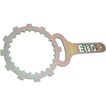 The Clutch Basket Holding Tool by Ebc features a circular, toothed ring and flat handle with EBC/CT024 cut-out text—ideal for removing or unlocking clutch retainer bolts during motorcycle maintenance.