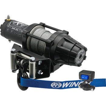 The AM-25 Assault Winch 2500lb Steel Cable by KFI Products is a black ATV winch with a coiled steel cable, heavy duty electric contactor, blue KFI WINCH strap, and a wired remote control featuring IN and OUT buttons.
