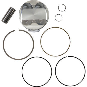 Polished silver metal piston with matching wrist pin, two small circular clips, and four black piston rings arranged on.