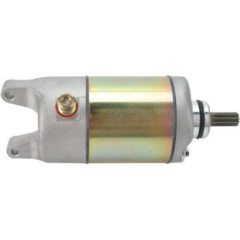 Silver and gold metallic Kawasaki starter motor with mounting holes and gear shaft extension.