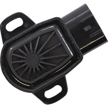 Close-up of the Polaris Throttle Position Sensor by Moose Offroad, black with side mounting slots, an electrical connector, and radial ridges encircling a central circle on its surface.