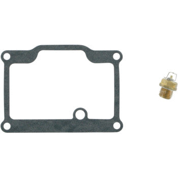 A rectangular black gasket from the Polaris Carburetor Repair Kit by K&L Supply, featuring four bolt holes and a small bottom opening, is shown next to a brass jet with a white tip on a plain white background.