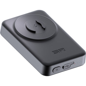 The Wireless Power Bank - 10,000 mAh - SPC+ by Sp Connect is a black, rectangular device with rounded edges, a circular raised pad on top, side buttons and USB-C port, plus four LED indicator lights.