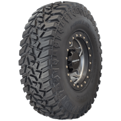 The Tire Parallax 32X10R15 by GBC is a 10-ply, large off-road tire with deep, aggressive tread and heavy-duty siping, mounted on a black and silver alloy wheel. Sidewall branding and model details enhance its rugged design and durability.