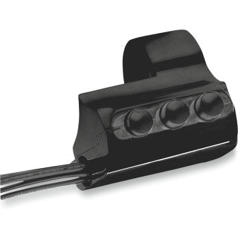 Close-up of the Performance Machine Contour Billet Handlebar Switch - Right Side - Three Button - Black, showcasing its 3-button housing with round indents and two attached metal cables.