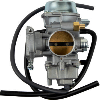 Silver metal Polaris replacement carburetor with black rubber hose attached, detailed mechanical components visible.