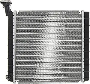 The Radiator Assembly by Polaris features metal cooling fins and black plastic sides, shown from above on a white background with the radiator cap at the top left—an essential OEM part for your Polaris UTV.
